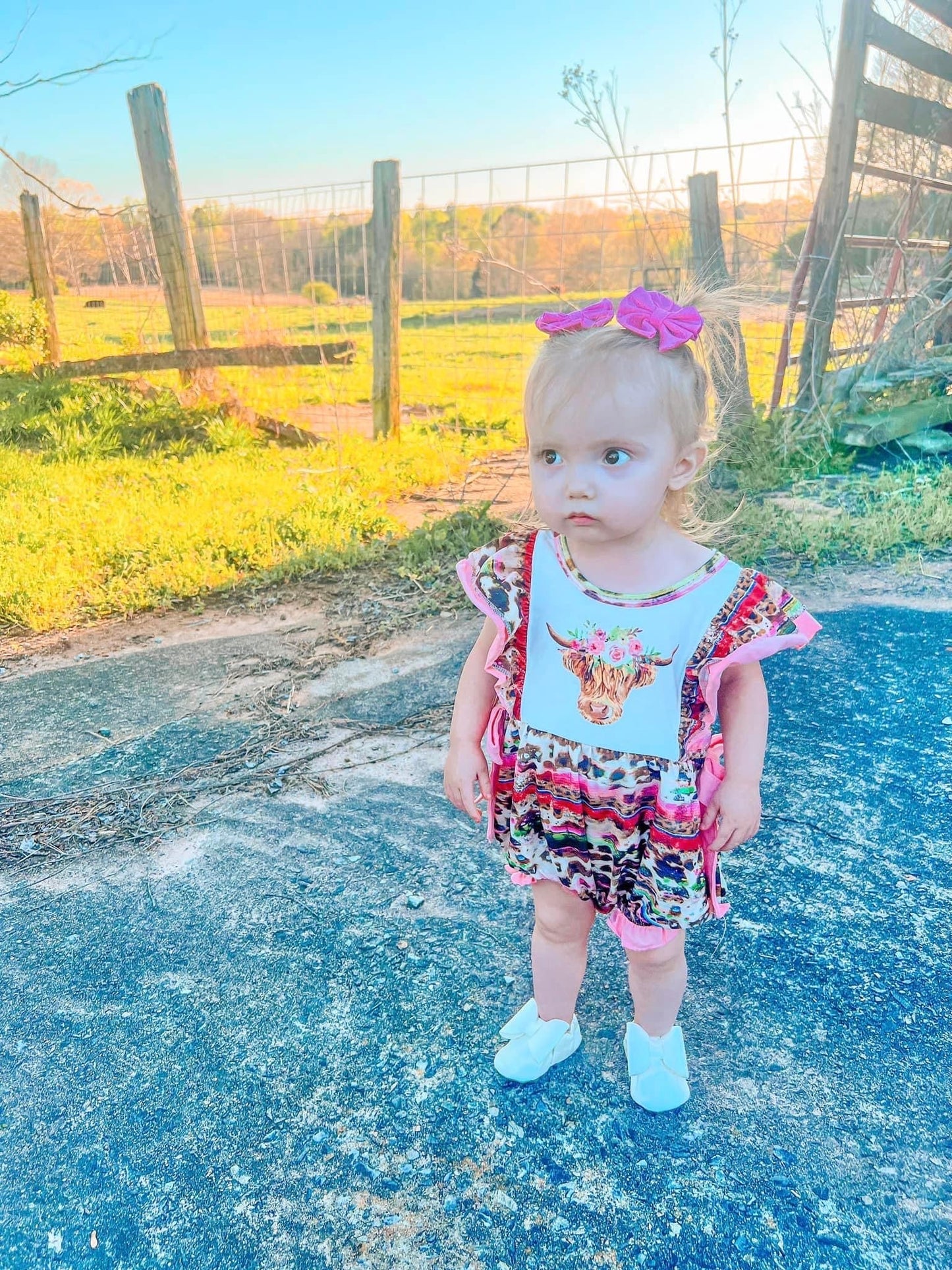 Pink serape cow romper