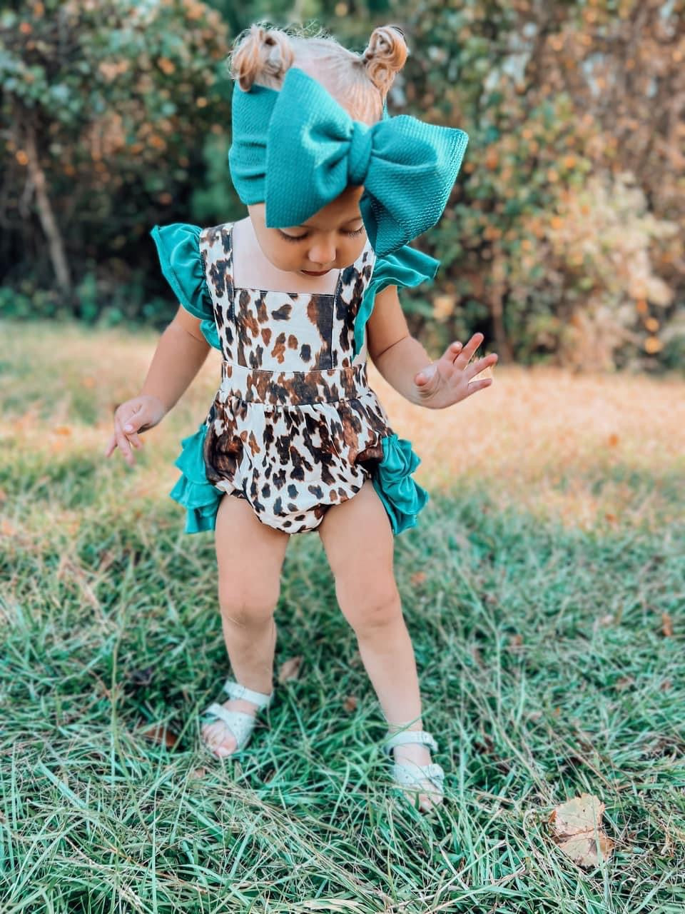 Cowhide and turquoise ruffle romper